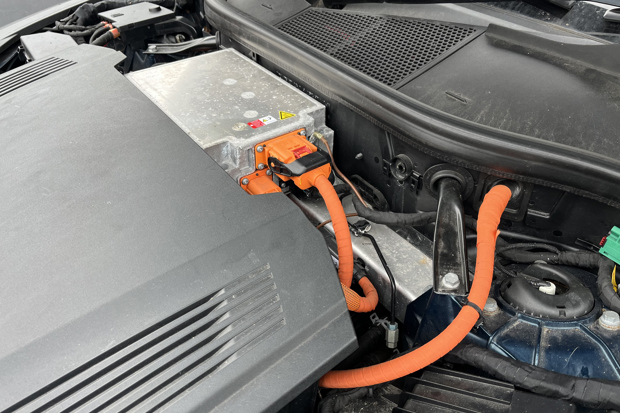 Orange high voltage cables under the bonnet of an Audi e-tron EV