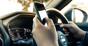 Half of young drivers use their phone to play music while driving