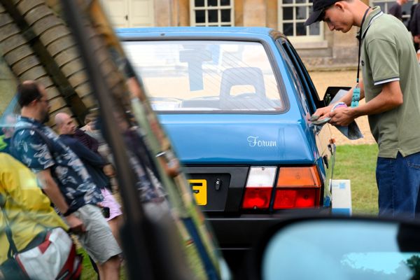 Simon Packowski polishing his Skoda Favorit Forum ahead of being judged Concours de l'Ordinaire Champion at FOTU 2025