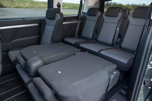 Toyota Proace Verso Electric Review: rear passenger interior with second-row seats partially folded